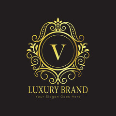 Letter V Luxury brand logo design with a royal gold crown emblem and elegant typography
