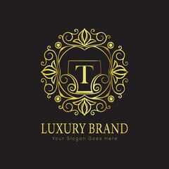 Letter T Luxury brand logo design with a royal gold crown emblem and elegant typography
