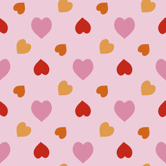 Seamless pattern with magic pink, red and orange hearts on light pink background. Vector image.