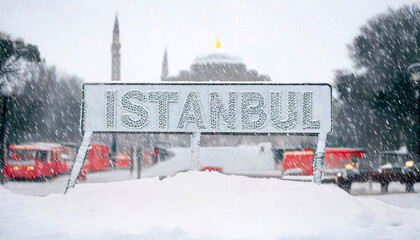 Obraz premium sign saying -Istanbul- under the snow. heavy snowfall in Istanbul, blurred taksim square