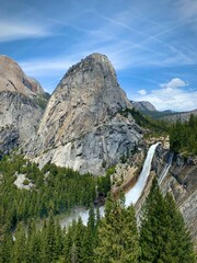 Roaring Waterfall and Dome-Shaped Mountain (Yosemite National Park, California, USA)

