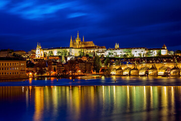 Panoramic view of Prague Castle and St. Vitus Cathedral over the Vltava River in Prague, Czech Republic.