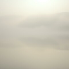 Obraz premium Misty Morning Lake Reflection with Mountaintop Mist - Serene Landscape
