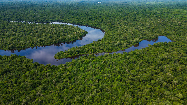 AERIAL PHOTOS OF THE NANAY RIVER AND BOATS NAVIGATING IN ITS WATERS, IN THE PERUVIAN AMAZON JUNGLE, BLACK WATER IGAPO WITH COMMUNITIES OF PEOPLE SURROUNDING THE NANAY.