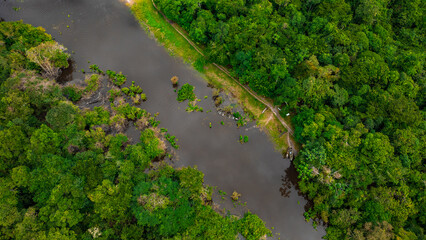 AERIAL PHOTOS OF THE NANAY RIVER AND BOATS NAVIGATING IN ITS WATERS, IN THE PERUVIAN AMAZON JUNGLE, BLACK WATER IGAPO WITH COMMUNITIES OF PEOPLE SURROUNDING THE NANAY.