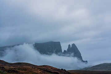 Morning mist over Seiser Alm in the Dolomites, Italy.