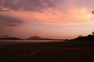 Serene Sunset Over the Lake
A calm lake stretches out beneath a sky painted with warm hues of pink...