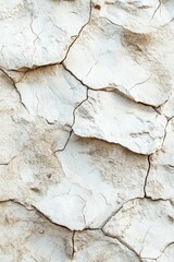 Fototapeta premium Beige stone texture background with cracks, ideal for rugged product presentations