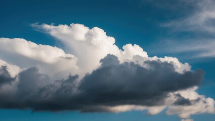 Dramatic clouds against a blue sky create a serene atmosphere, showcasing nature's beauty and the dynamic patterns of weather