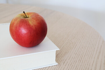 apple and book background copy space