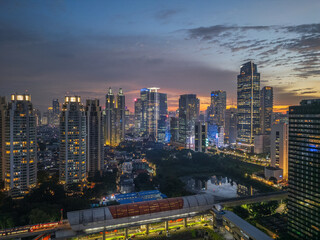 Fototapeta premium Drone Aerial View of Jakarta Downtown During Sunset