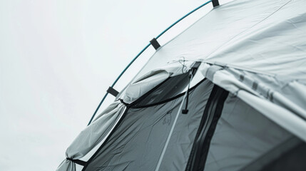 Full view of a white camping tent with mesh ventilation