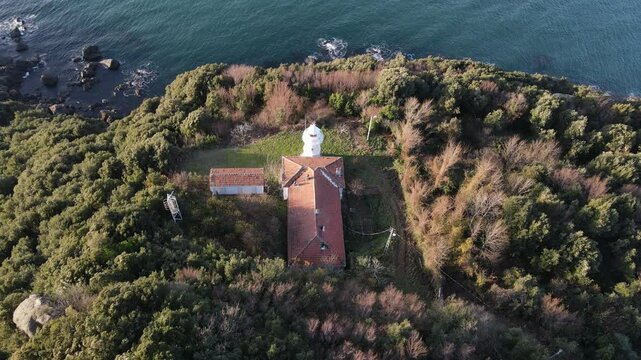 Aerial Lighthouse Across Sea