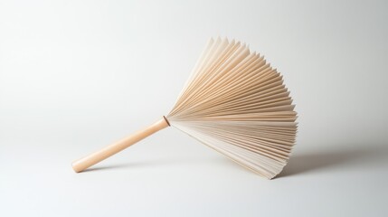 Elegant Open Fan with Pleated Paper and Wooden Handle on Minimalist Background for Decorative or Art Use in Various Creative Projects