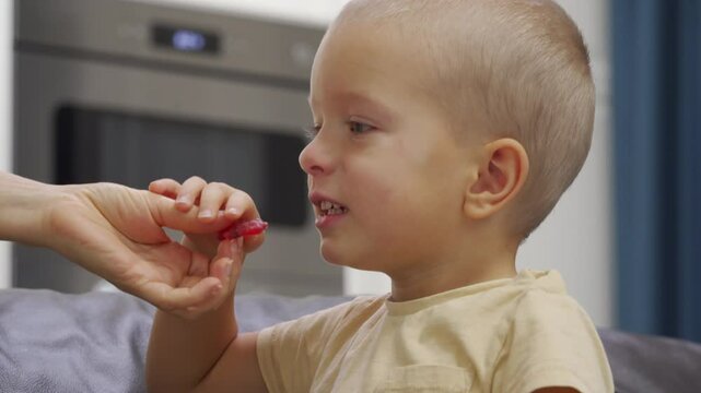 Mom gives her hyperactive child soothing gummies for children.