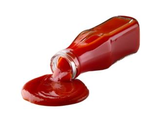 Glass jar of ketchup spilling its contents