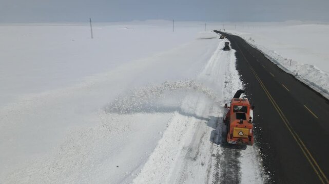 Snow Plower Working in Asphalt