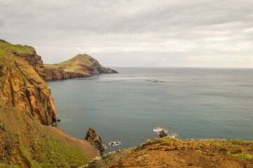 The majestic cliffs surrounded by blue waters. Vereda da Ponta de Sao Lourenco, Madeira, Portugal