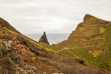The majestic cliffs surrounded by blue waters. Vereda da Ponta de Sao Lourenco, Madeira, Portugal