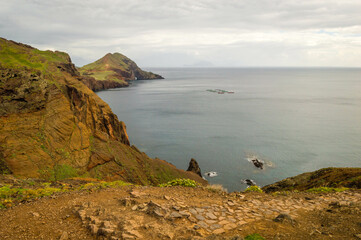 The majestic cliffs surrounded by blue waters. Vereda da Ponta de Sao Lourenco, Madeira, Portugal