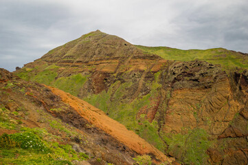 The majestic cliffs surrounded by blue waters. Vereda da Ponta de Sao Lourenco, Madeira, Portugal