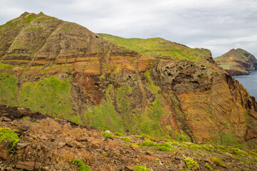 The majestic cliffs surrounded by blue waters. Vereda da Ponta de Sao Lourenco, Madeira, Portugal