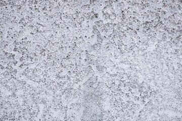 Textured White Concrete Surface with Small Holes and Subtle Imperfections, Minimalistic Background