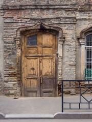 Traditional architecture in the Old Town of Tbilisi. Wooden old door. Tbilisi, Georgia.
