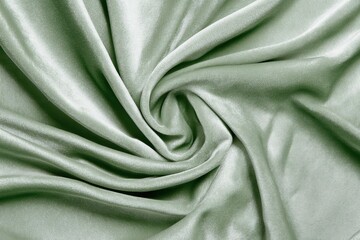 Obraz premium 緑の滑らかな布地が美しくシワを形成する様子