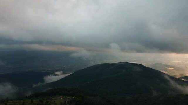 Aerial mystical view of clouds descending on a village between the mountains in Sakarya