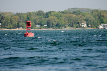  A navigational buoy near shore in Surgeon Bay in late May off the shore of Potawatomi State Park, Sturgeon Bay, Door County, Wisconsin