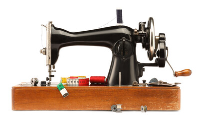 Sewing machine with measuring tape and spools of threads isolated on white
