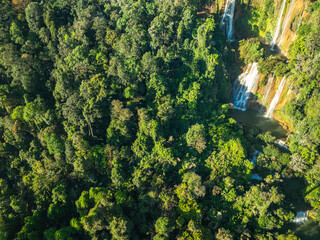 Fototapeta premium Aerial View The most beautiful waterfalls in Thailand..Thi Lo Su Waterfall The Largest Waterfall in Thailand.Thi Lo Su Waterfall stands tall as a hidden gem within Umphang Wildlife Sanctuary.