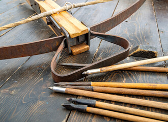 Fragment of a medieval crossbow with bolts (replica), historical reconstruction festival 