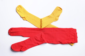 Different child's tights on white background, top view