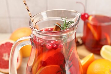 Delicious punch with rosemary in jug, closeup