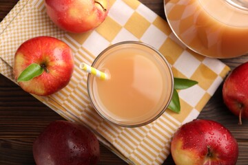Tasty apple juice and fresh fruits on wooden table, flat lay