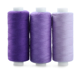 Spools of colorful sewing threads isolated on white