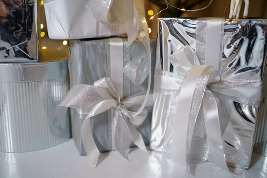 Decoratively wrapped metallic gifts arranged beautifully for a festive celebration