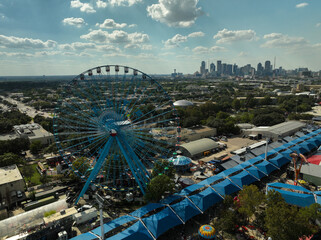 Aerial view of the Texas State Fair Ferris Wheel and the Dallas, Texas skyline
