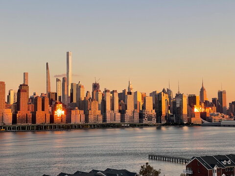 New York City skyline at sunset - Powered by Adobe