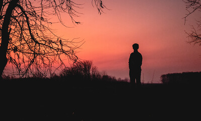 Beautifull sunset in peri-urban ambience with a person on it, Argentina. 