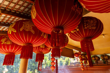 red chinese lanterns and offerings at Wat Phnom in Phnom Penh,