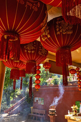 red chinese lanterns and offerings at Wat Phnom in Phnom Penh,