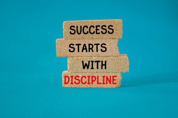 Success starts with discipline symbol. Concept words Success starts with discipline on brick...