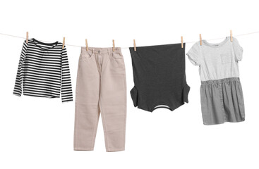 Different clothes drying on laundry line against white background