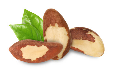 Brazil nuts and green leaves isolated on white