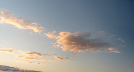 Clouds illuminated by sunset light showcasing vibrant colors in the evening sky