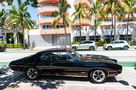 Miami Beach, Florida USA - June 9, 2024: 1968 pontiac gto black at ocean drive miami beach. side view