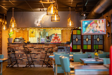 Natural restaurant interior with scenic view at sunset
